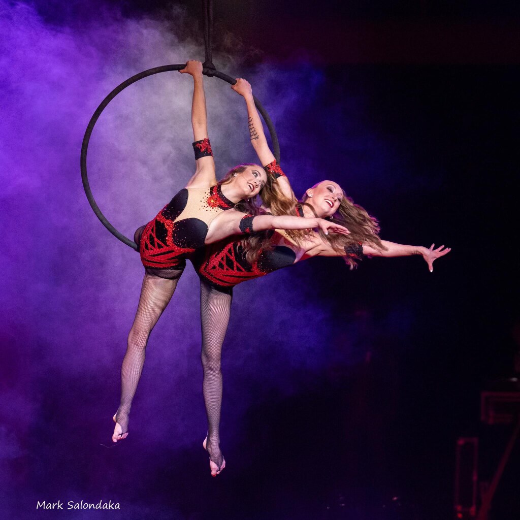 Circus aerial artist performing on silks